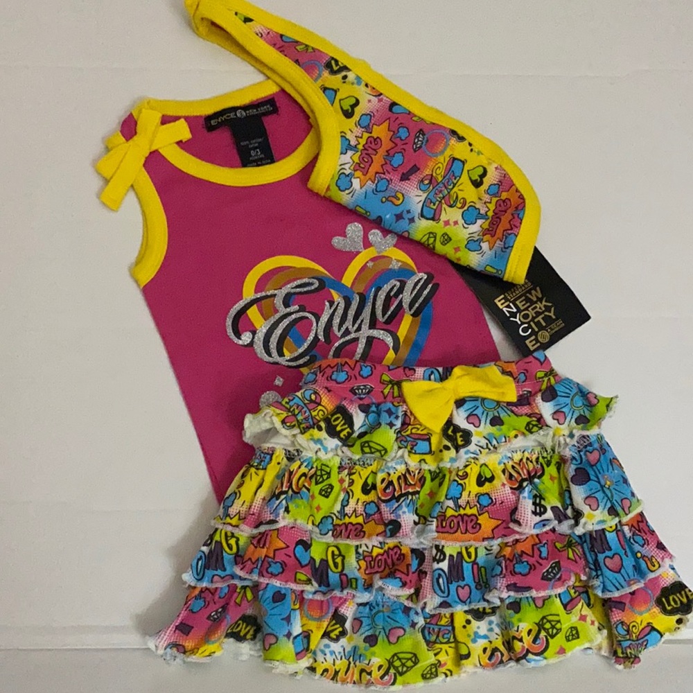 Enyce pink and yellow skirt and onesie with Bib.